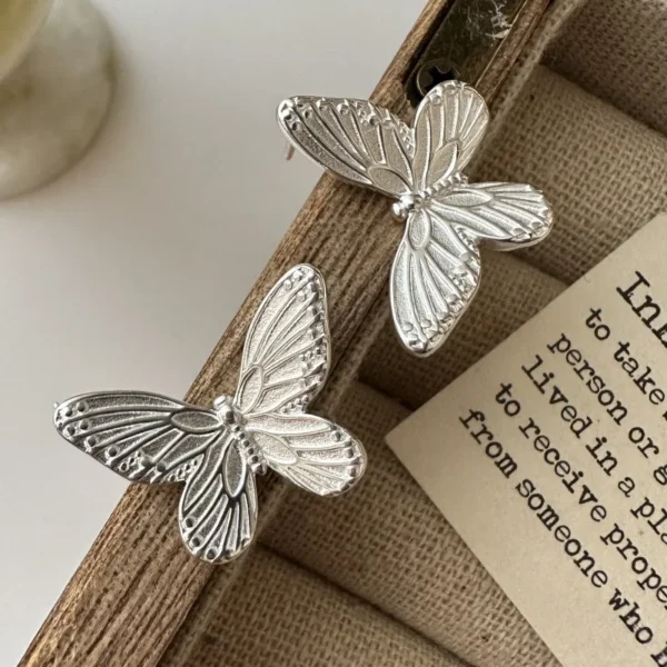 S925 sterling silver European version niche design texture butterfly earrings Korean fashion blogger personalized ear jewelry