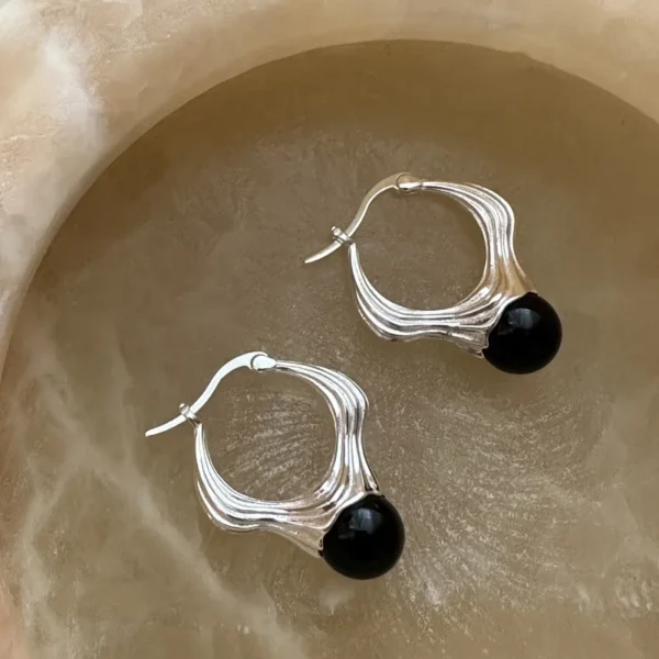 S925 sterling silver European niche design streamline liquid black agate earrings Korean style blogger ear buckle wholesale