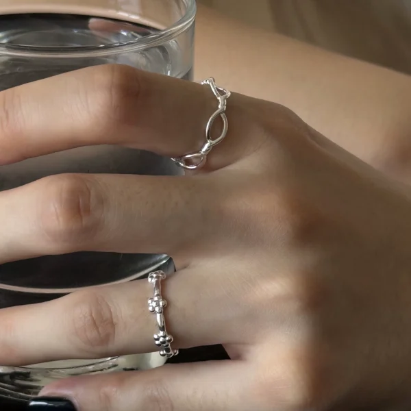 Design niche women's ring S925 sterling silver hollow simple lines literary and artistic sweet temperament small fresh flower ring